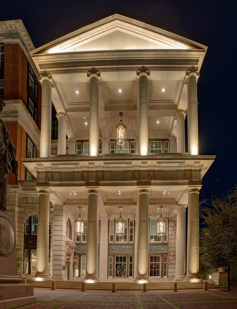 In-grade uplights iluminate ionic-style columns on the shorter side of the singular workplace | Freedom Place | Old Parkland | Dallas Texas