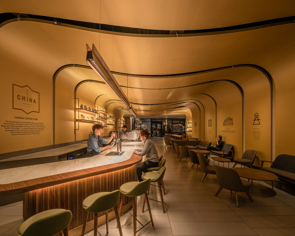 LD+A April 2024 | A Third-Place Finish | The store’s signature element is the ceiling above the bar, which is adorned with golden ribbons that mimic the undulations of water